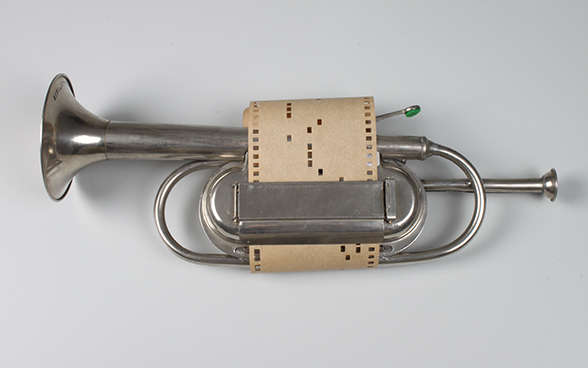 Toy trumpet with musical mechanism