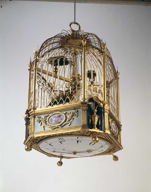 Cage avec oiseaux chanteurs, horloge et serinette